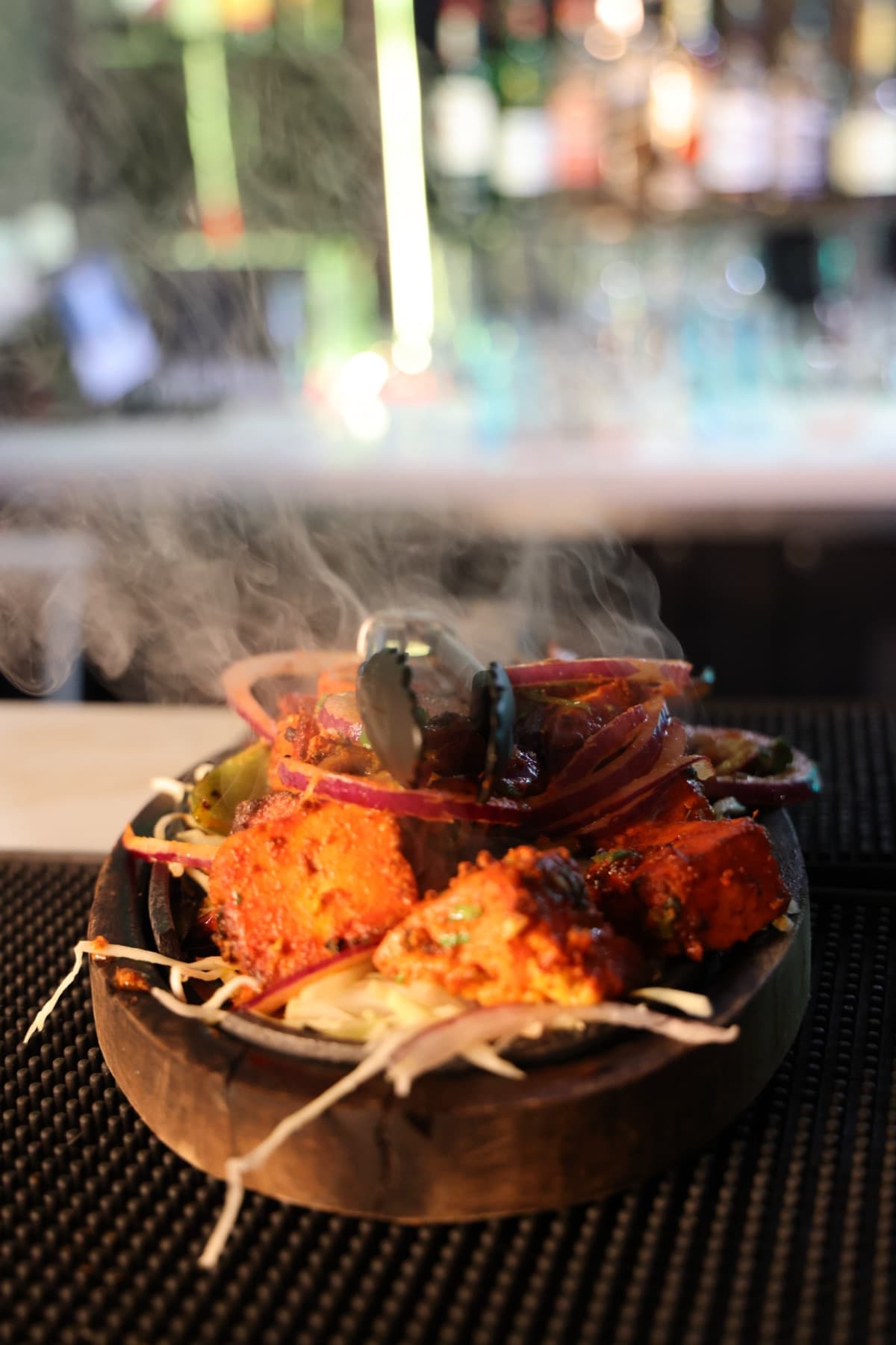 A steaming Indian platter prepared for service