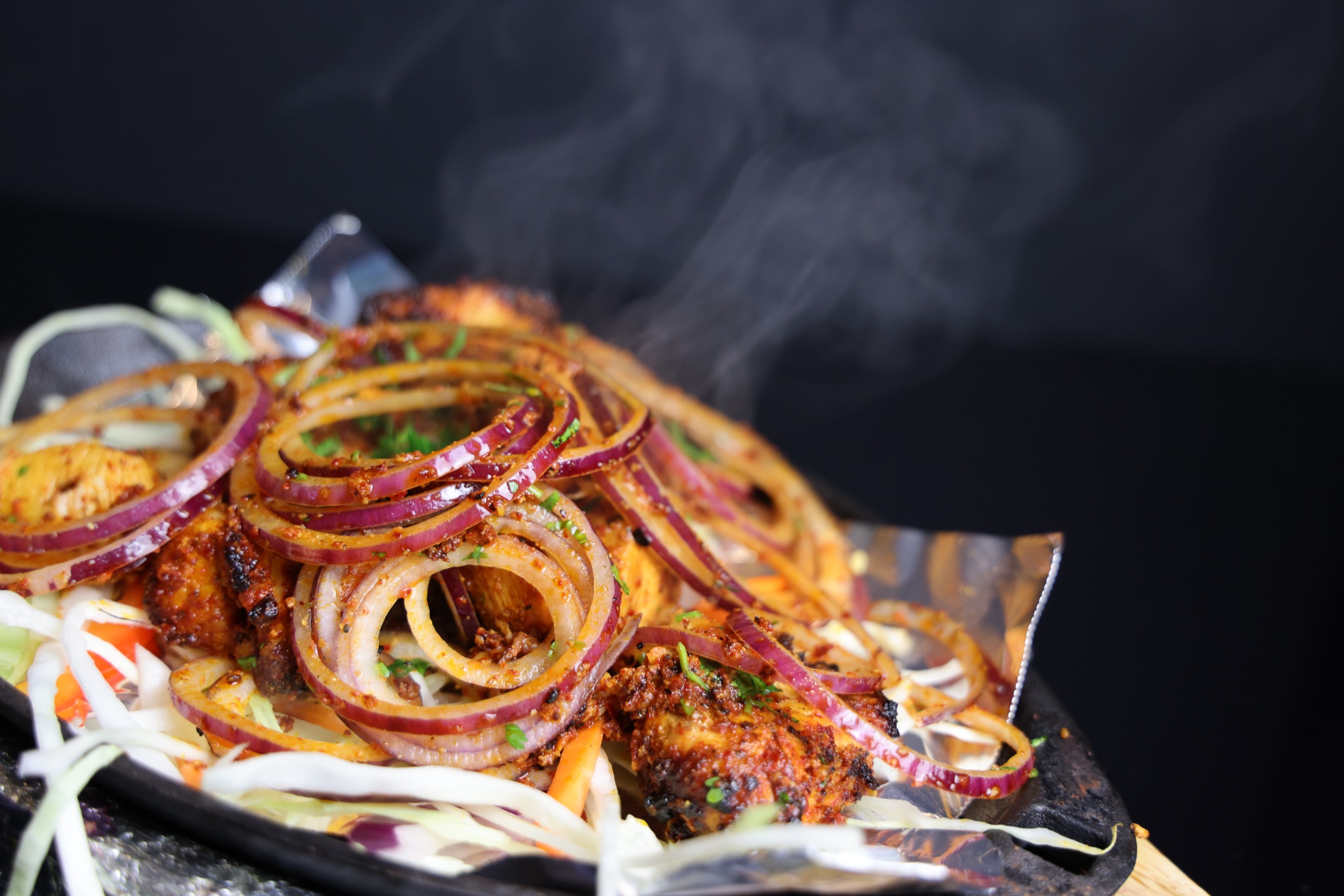 A sizzling grilled Indian platter
